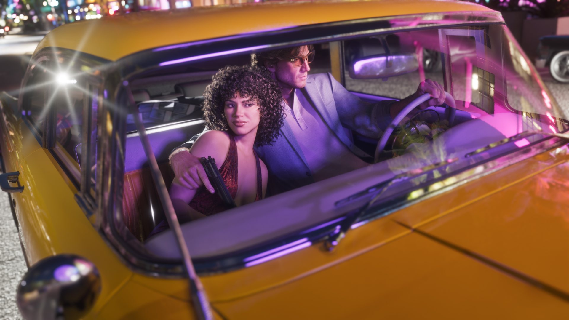 Jason and Lucia in a yellow classic car at night, Lucia holding a pistol